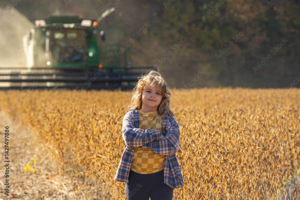 Child in a wheat field. Little farmer at work. Kid at rural countryside. Kid on a farm. Carefree childhood outdoors. Kid walking in golden wheat. Kid in the meadow. Harvest season fun. Child on
