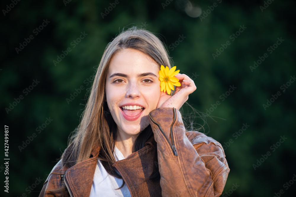 Spring face. Flower model portrait. Summer beauty. Romantic Girl. Fun woman in nature. Romantic flower portrait. Beautiful girl with blossom. Woman with floral smile. Funny summer face portrait.