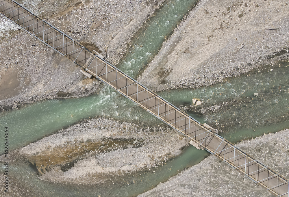 Aerial view of the construction of a bridge over a river crossing in Hatu Bulico Village, Ainaro Municipality, Timor Leste. The development of transportation access is still very much needed in Timor