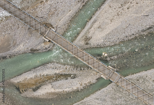 Obraz na płótnie Aerial view of the construction of a bridge over a river crossing in Hatu Bulico Village, Ainaro Municipality, Timor Leste. The development of transportation access is still very much needed in Timor w salonie