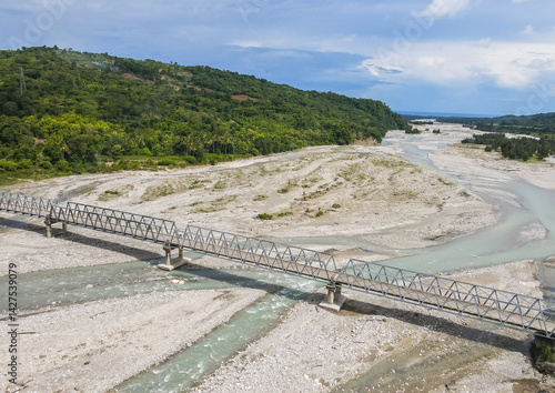 Obraz na płótnie Aerial view of the construction of a bridge over a river crossing in Hatu Bulico Village, Ainaro Municipality, Timor Leste. The development of transportation access is still very much needed in Timor w salonie