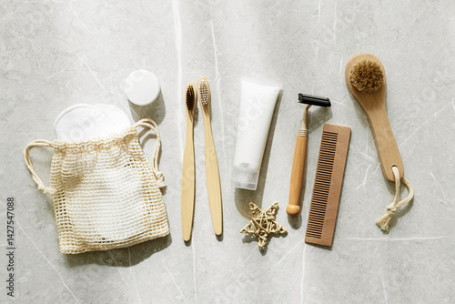 Obraz na płótnie Minimal aesthetic lifestyle with Eco-Friendly Personal Care Products or natural Travel cosmetics essentials, bamboo toothbrushes, toothpaste, safety razor, facial reusable pads, shadow at sunlight w salonie