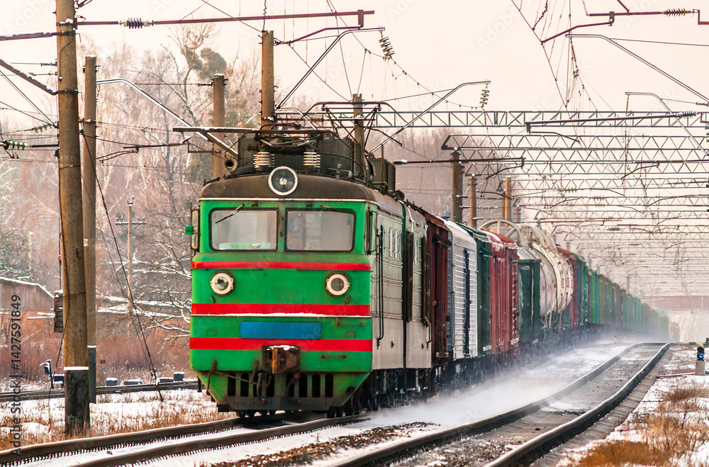Freight electric locomotive in winter in Kyiv Oblast of Ukraine