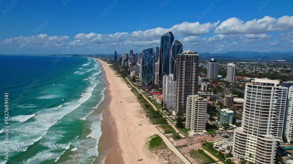Aerial panorama of Gold Coast showcasing endless sandy beaches, the ocean, towering skyscrapers, and low-rise suburbs. Bright summer day with vibrant colors and stunning coastal views. Aerial panorama of Gold Coast showcasing endless sandy beaches, the ocean, towering skyscrapers, and low-rise suburbs. Bright summer day with vibrant colors and stunning coastal views.