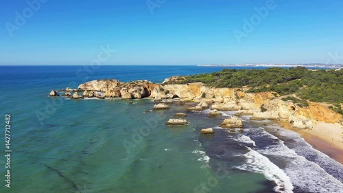 The beautiful rocky coast of the Algarve towards Albufeira, Europe, Portugal, Algarve, in summer, on a sunny day. 