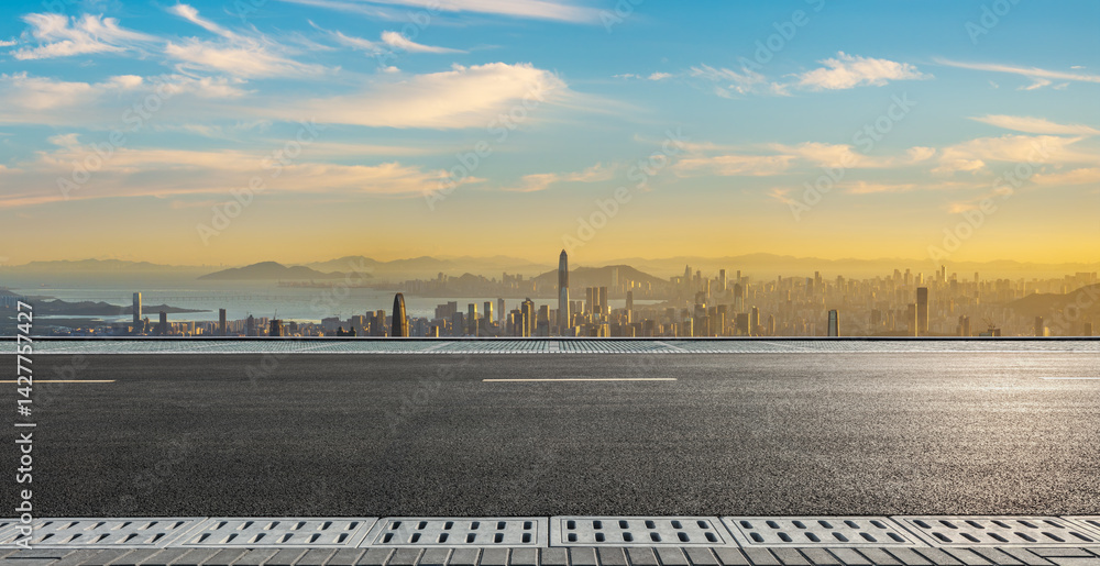 Asphalt road and city skyline with modern buildings scenery at sunset in Shenzhen