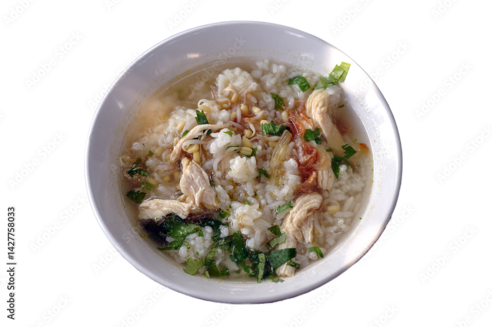 A bowl of warm chicken soto is served on the table A bowl of warm chicken soto is served on the table
