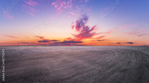 Fototapeta Naklejka Na Ścianę i Meble -  Asphalt road and beautiful sky clouds nature landscape at dusk
