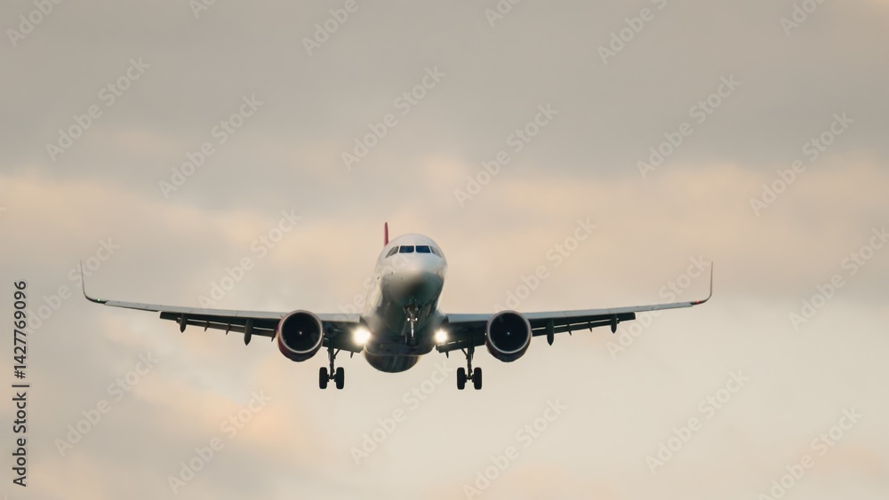 Majestic airplane approaching runway during twilight with dynamic clouds enhancing the dramatic sky Majestic airplane approaching runway during twilight with dynamic clouds enhancing the dramatic sky