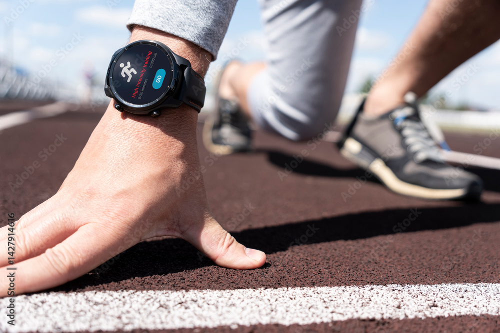 Running man with smart watch. Concept of The technology to check health while exercising. high-intensity training with an app on smart watch