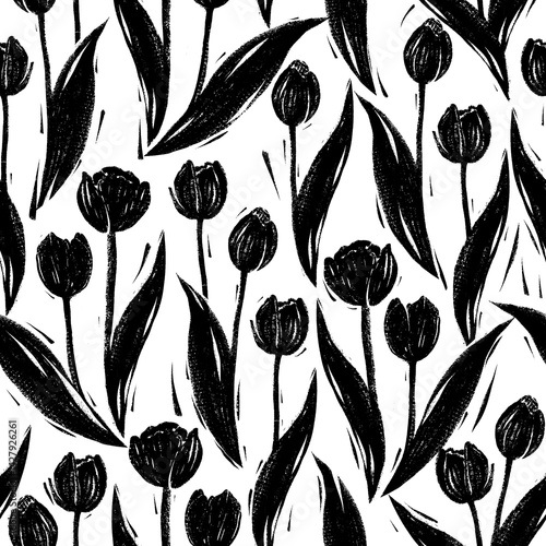 Seamless pattern with tulips in linocut technique with black paint on a white background