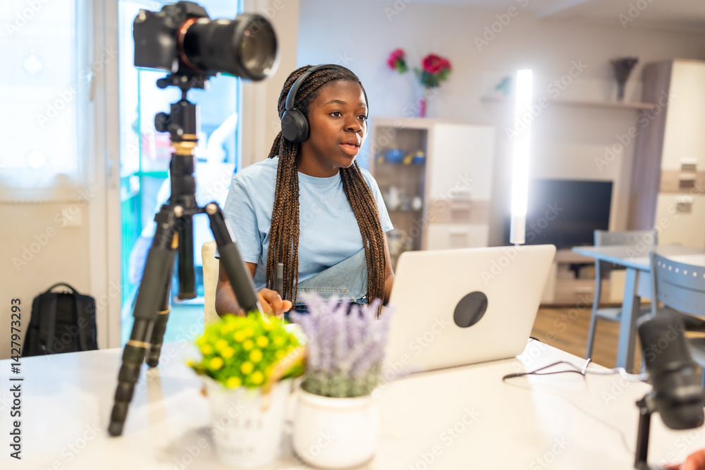 Teenager content creator recording video blog at home