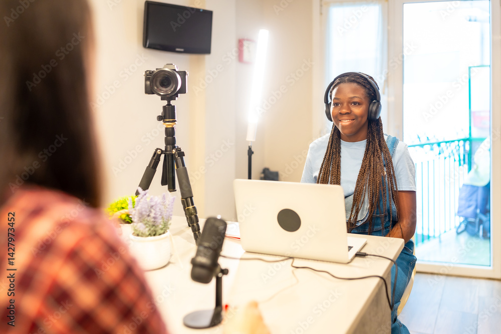 Teenage girls recording podcast or video at home