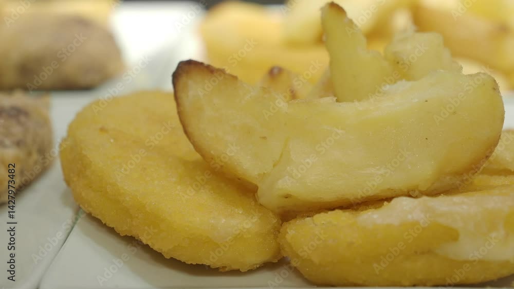 Crispy golden treats with soft fillings enjoyed at a local festival Crispy golden treats with soft fillings enjoyed at a local festival