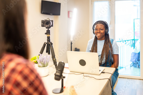 Obraz na płótnie Teenage girls recording podcast or video at home w salonie