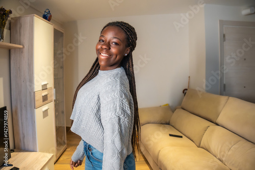 Obraz na płótnie Smiling teenager posing at home in living room w salonie