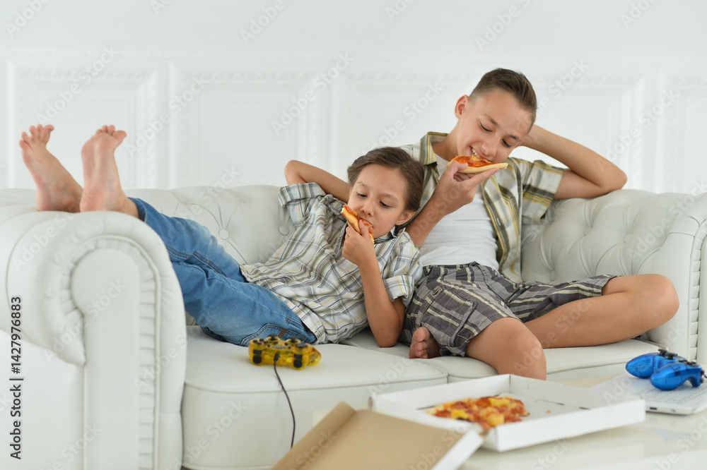 Kids Eating Pizza on the Couch