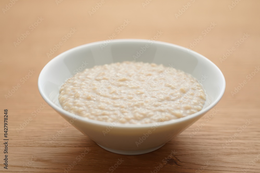 Plain oatmeal porridge in bowl Plain oatmeal porridge in bowl