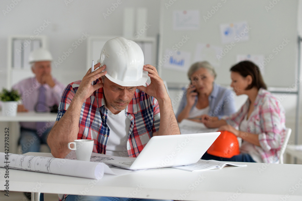 Stressed engineer at work on a project