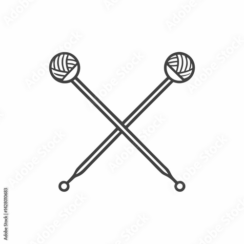 Crossed knitting needles with yarn balls, symbolizing creativity and crafting.