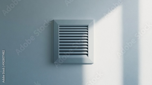 silver air vent on white wall  tech detail .