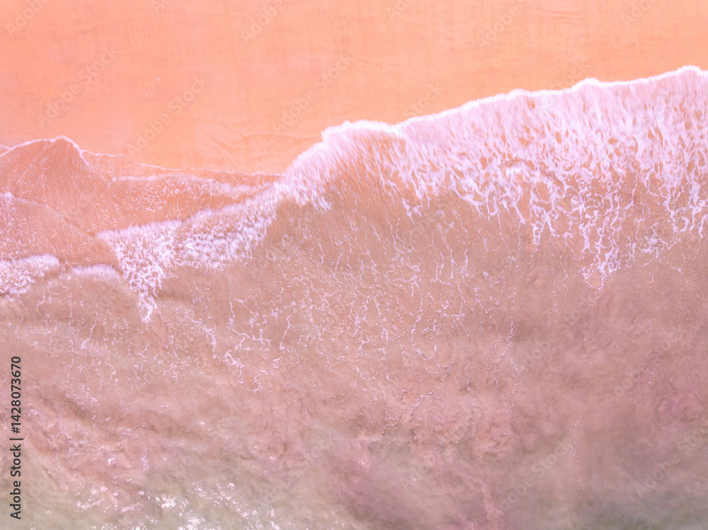 Fototapeta premium Beautiful colorful sand beach nature background,Amazing beach waves background, Aerial view wide angle sea background