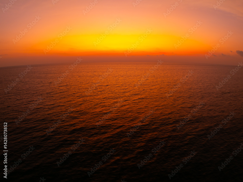 Naklejka premium Amazing sunset or sunrise sky over sea landscape,Beautiful colorful light of nature background,Drone camera shot nature view seascape