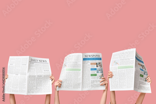 Women with newspapers on pi...