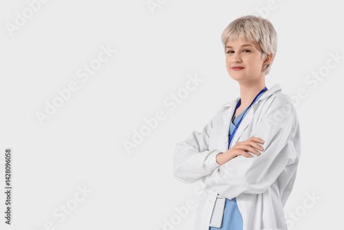 Young female doctor on ligh...