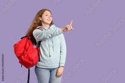 Happy female student with b...