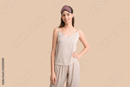 Young woman in pajamas and ...