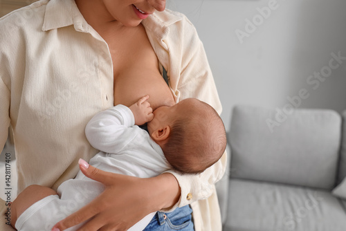 Mother breastfeeding her ba...