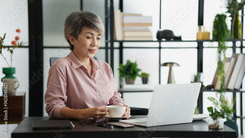 Senior business asian woman mature working in office