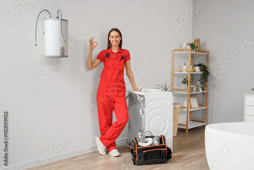 Female plumber showing OK n...
