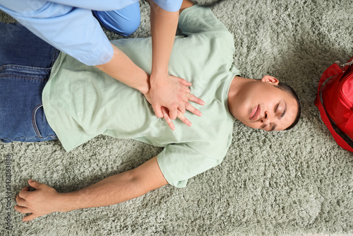 Female doctor doing CPR on ...