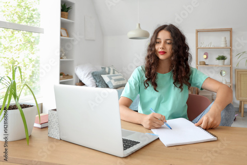 Teenage girl with notebook ...