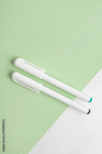 2 liners for drawing lying on a sheet of paper in the color of green tea