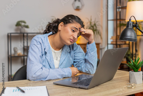 Angry furious woman freelancer using laptop while working at home office having nervous breakdown at work, stress management, mental distress problems, reaction to failure, losing temper. Lifestyle.