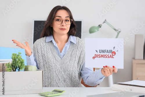 Fired businesswoman holding...