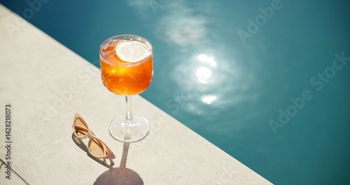 Cocktail, lemon and swimming pool with sunglasses and alcohol for summer holiday or vacation. Travel, resort and drink by water for outdoor luxury, hotel hospitality and break to relax by space