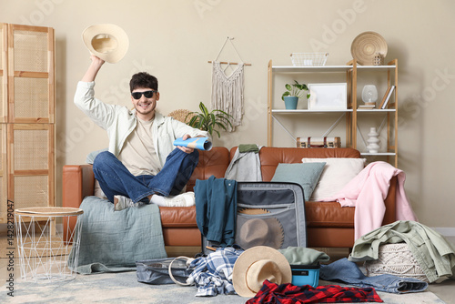 Happy male tourist with map...