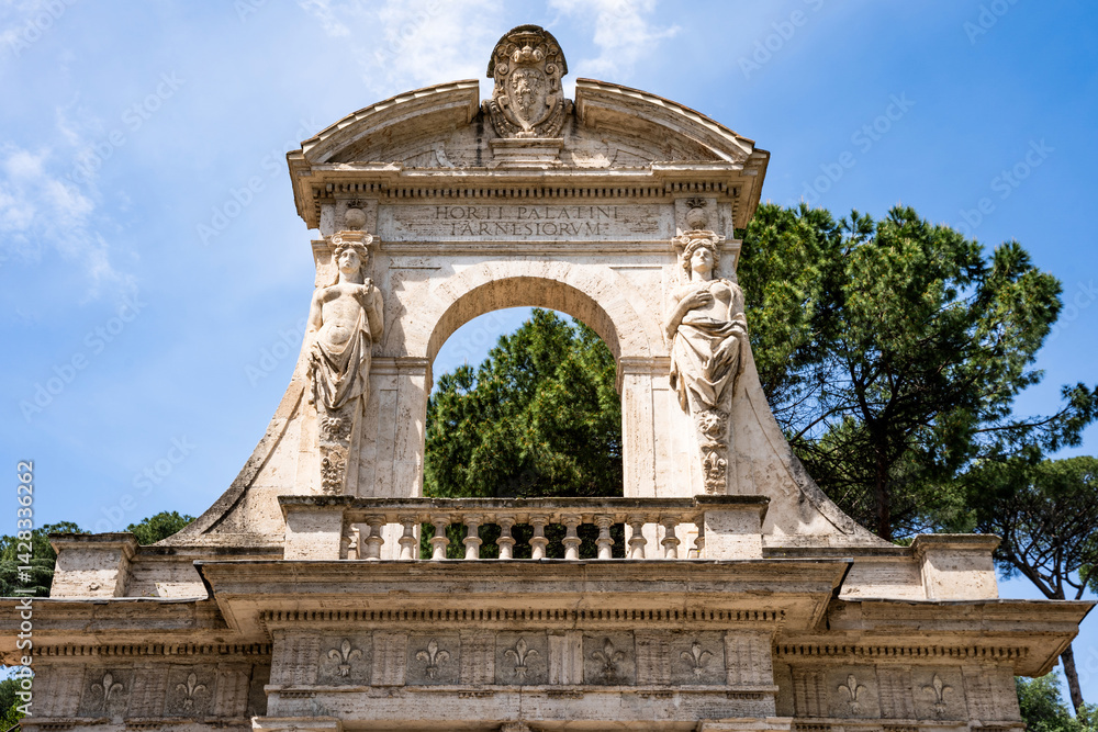 Fototapeta premium Entrance portal to the Farnese Gardens (Horti Palatini Farnesiorum) on the Palatine Hill, designed by Vignola for Cardinal Alessandro Farnese in the 16th century, in Rome, Italy