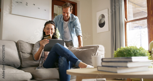 Tableau sur toile Discount, couple and woman with card, tablet and browsing for online shopping in living room or happy