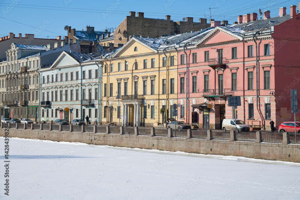Old mansions on the Fontanka River embankment on a sunny February day, Saint Petersburg