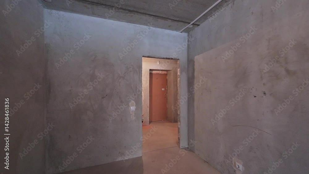 Image of an unfinished room, likely a part of a building under construction, with exposed walls and basic framework Image of an unfinished room, likely a part of a building under construction, with exposed walls and basic framework