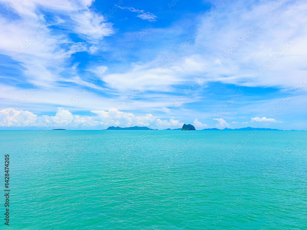 Fototapeta premium Summer travel, sea in Asia, the holiday season, which gives natural relaxing feeling. Beautiful natural environment and rest. Travel Thailand, the island in the middle of sea sky clouds Samui Thailand