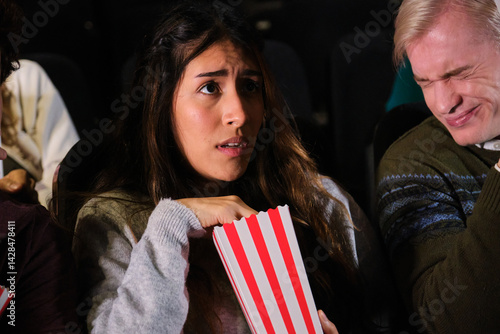 Obraz na płótnie Spectators experiencing different emotions during film projection in a movie theater w salonie