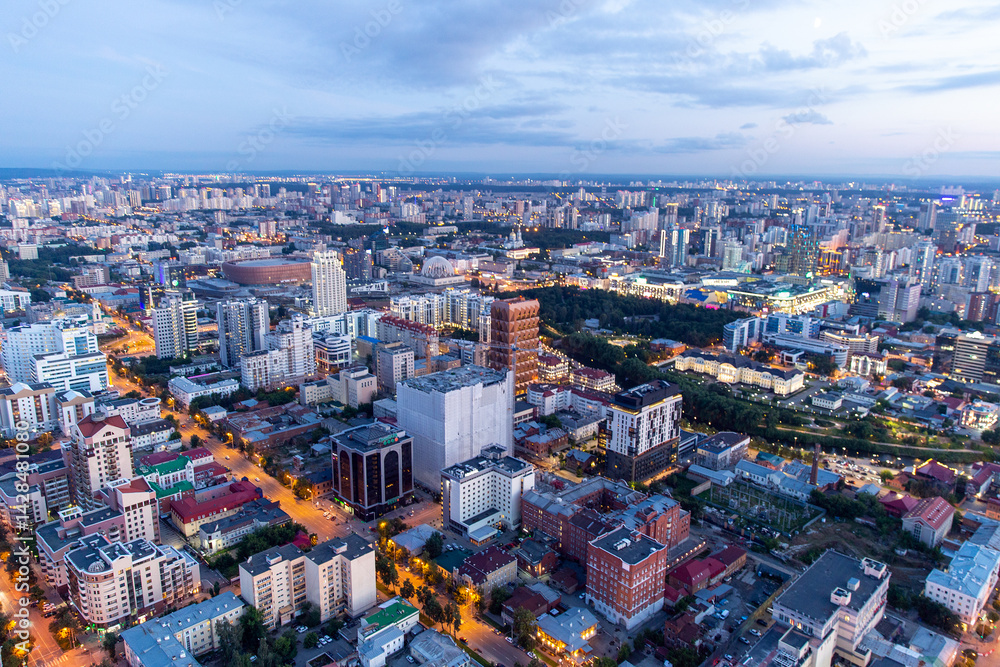 Obraz premium Evening panorama of the modern city of Yekaterinburg on the banks of the Iset river