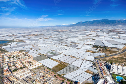Aerial view of Mar de Plastico, Sea of ​​Plastic, in Almería. A vast expanse of land covered with plastic greenhouses for the production of fruits and vegetables, larger than Almería itself