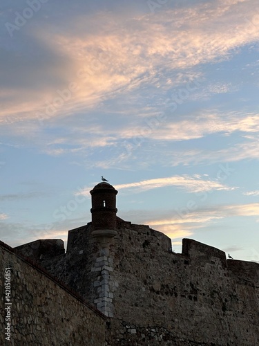 Obraz na płótnie Watchtower of the old Castillo de San Felipe castle under the sunrise sky, Ceuta, Spain, April 2024 w salonie